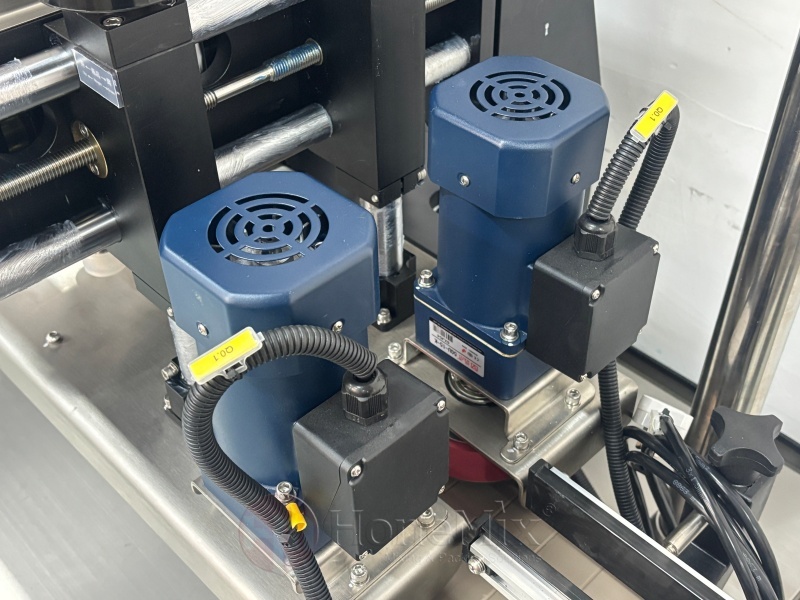 Bottle-Conveyor-And-Capping-Wheel-Mechanism-Close-Up