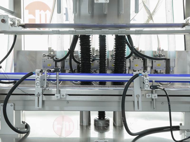 Honemix-Filling-Nozzles-And-Conveyor-Detail-View