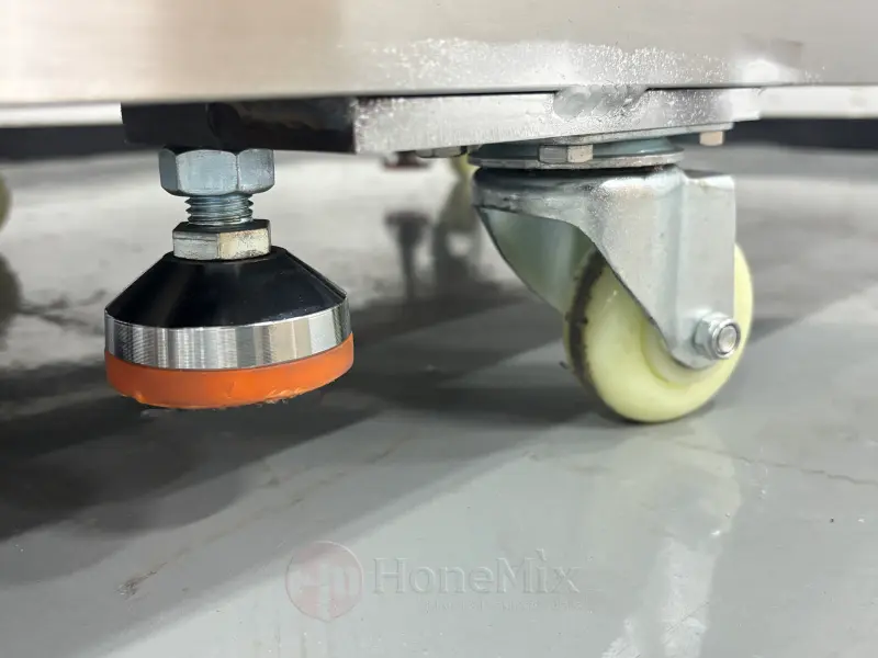 Caster wheel and adjustable leveling foot of the FT-APP powder pressing machine
