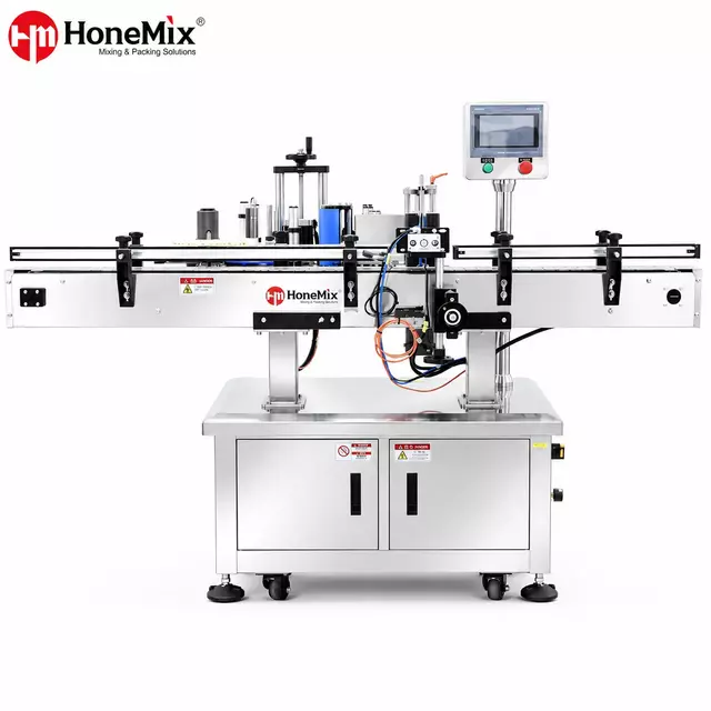 Machine d'&eacute;tiquetage de bouteilles rondes enveloppantes