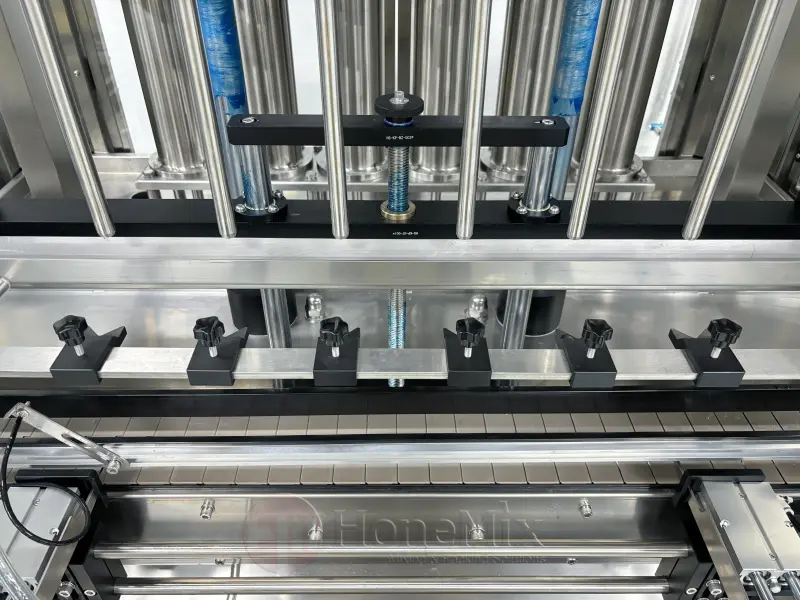 Filling Conveyor And Bottle Positioning System
