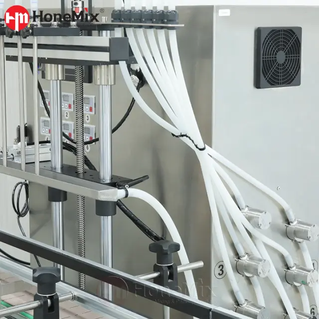 Gear pump filling system with silicone hoses for accurate liquid and oil bottle filling