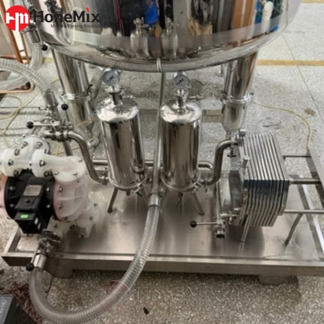 Bottom discharge valve and sanitary product piping beneath the 2000L perfume mixing tank